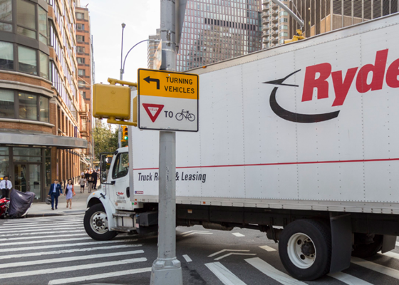 Image showing a yield to bikes sign with a truck turning in the background