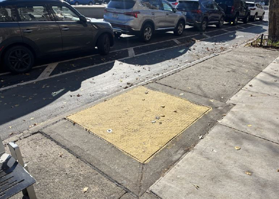 Emergency exit hatch in sidewalk