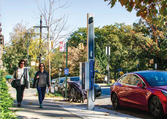Image of an electric vehicle charging station on a sidewalk