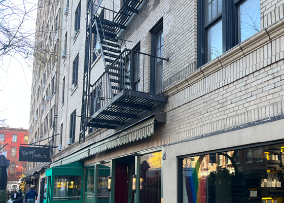 Image of a fire escape over the sidewalk